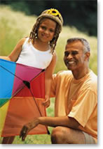 Image of man and child with kite
